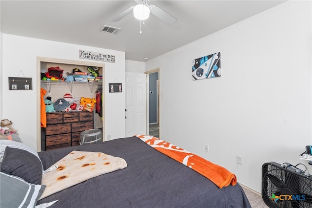 carpeted bedroom featuring a closet and ceiling fan