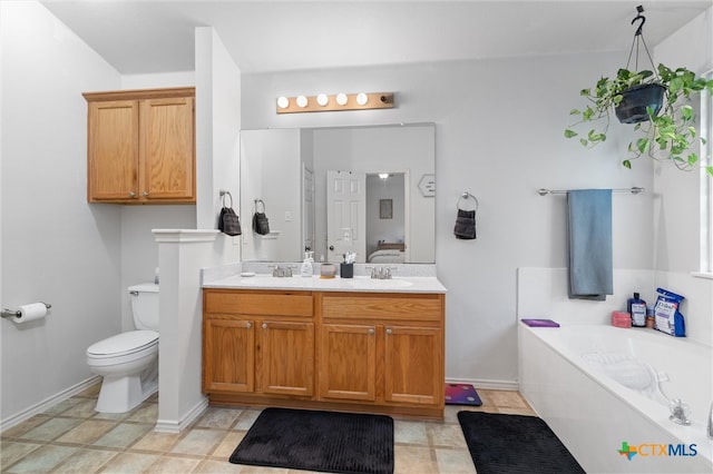 bathroom featuring vanity, toilet, and a bath