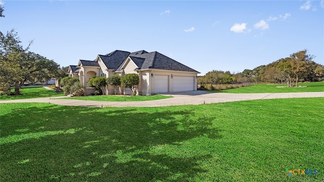 view of front facade with a front lawn and a garage