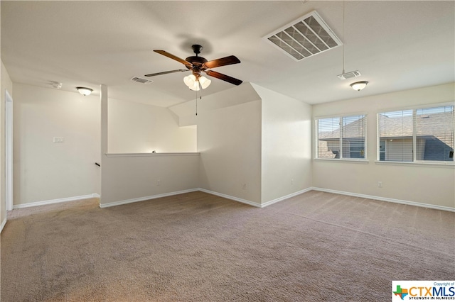 unfurnished room featuring vaulted ceiling, ceiling fan, and carpet floors