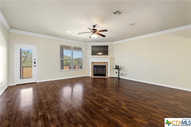 unfurnished living room with a fireplace, dark hardwood / wood-style flooring, and crown molding