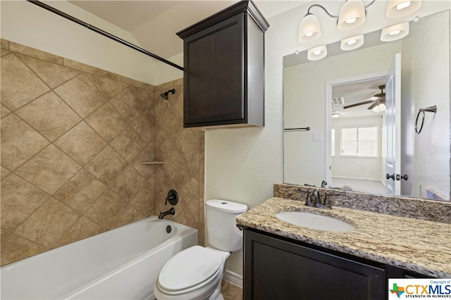 full bathroom with toilet, tiled shower / bath combo, vanity, and ceiling fan