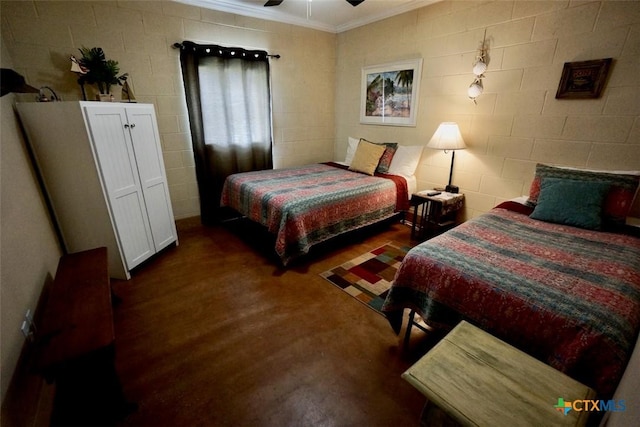 bedroom featuring crown molding, wood finished floors, and ceiling fan