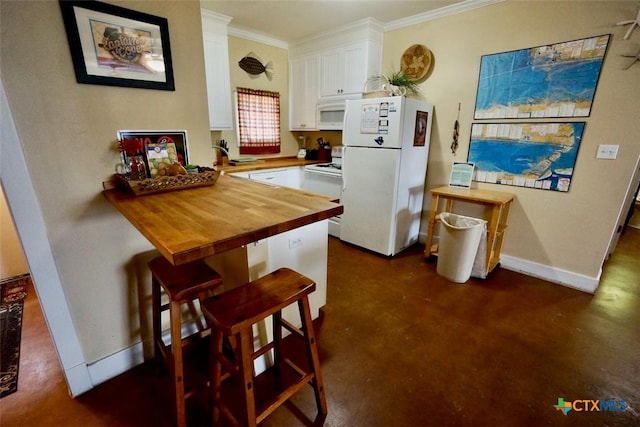 kitchen featuring butcher block countertops, a kitchen breakfast bar, white appliances, white cabinets, and crown molding