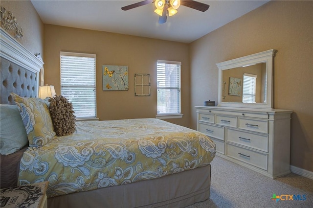 bedroom with baseboards, carpet, and a ceiling fan