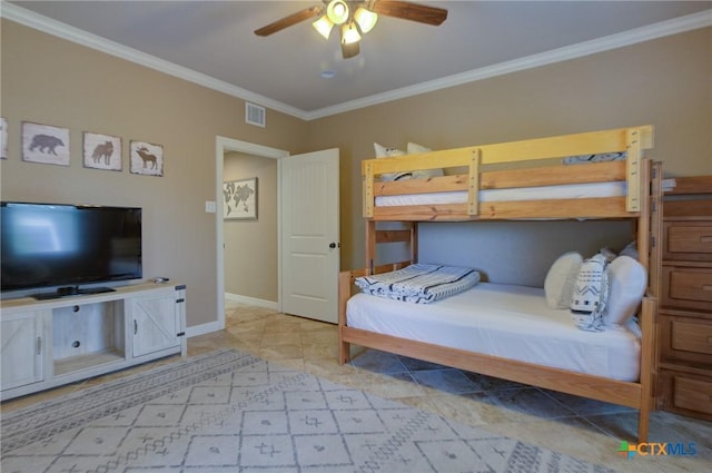 bedroom with a ceiling fan, visible vents, crown molding, baseboards, and light tile patterned flooring