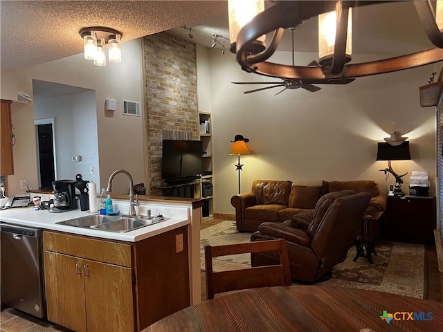 living room with vaulted ceiling, visible vents, track lighting, and ceiling fan