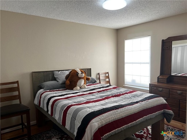 bedroom featuring a textured ceiling