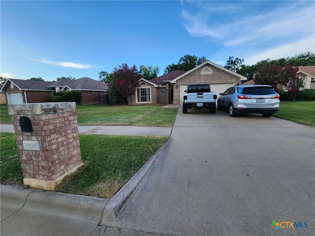 2006 Indian Camp Trl, Copperas Cove, TX 76522 - ranch-style home with a front yard, driveway, and a garage