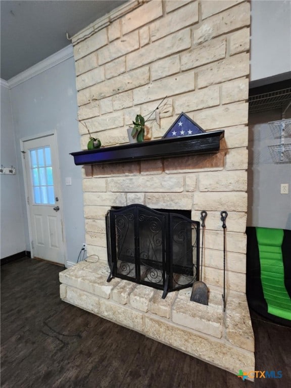 2006 Indian Camp Trl, Copperas Cove, TX 76522 - detailed view of a fireplace, crown molding, and wood finished floors