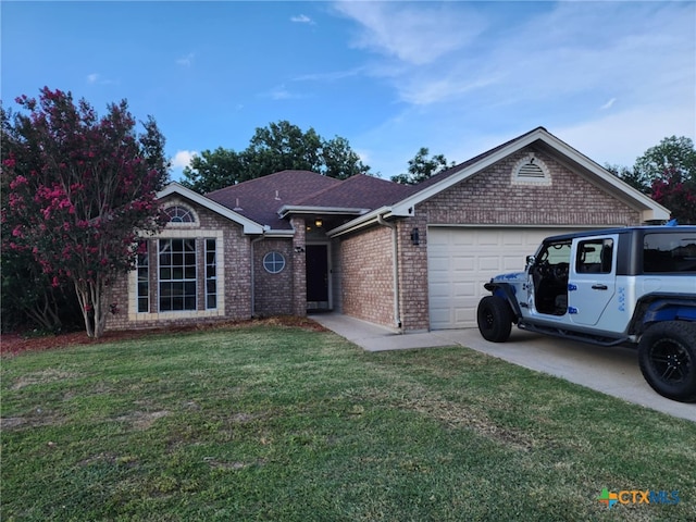 2006 Indian Camp Trl, Copperas Cove, TX 76522 - ranch-style home with brick siding, a garage, a front lawn, and driveway
