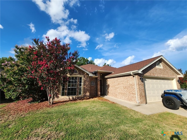2006 Indian Camp Trl, Copperas Cove, TX 76522 - ranch-style home featuring an attached garage, brick siding, a front yard, and concrete driveway