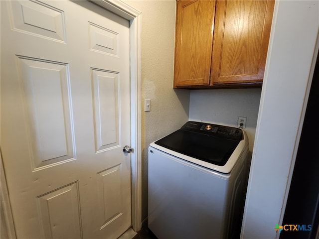 2006 Indian Camp Trl, Copperas Cove, TX 76522 - washroom with washer / dryer and cabinet space