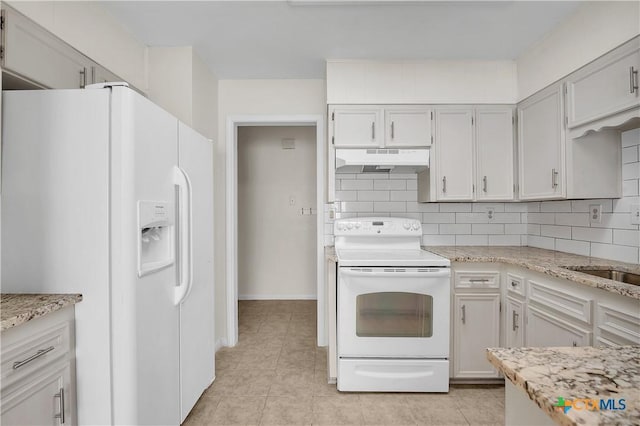 kitchen featuring white cabinets, white appliances, decorative backsplash, and light tile patterned flooring