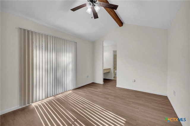 unfurnished room featuring ceiling fan, wood-type flooring, and lofted ceiling with beams