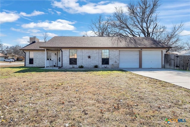 ranch-style house with a garage and a front yard