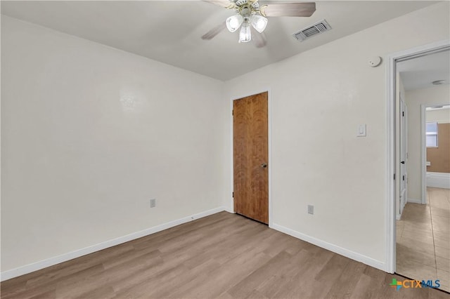 unfurnished room with light hardwood / wood-style floors and ceiling fan