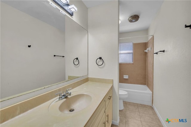 full bathroom with toilet, vanity, tiled shower / bath, and tile patterned flooring