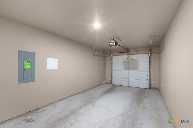 garage featuring electric panel and a garage door opener