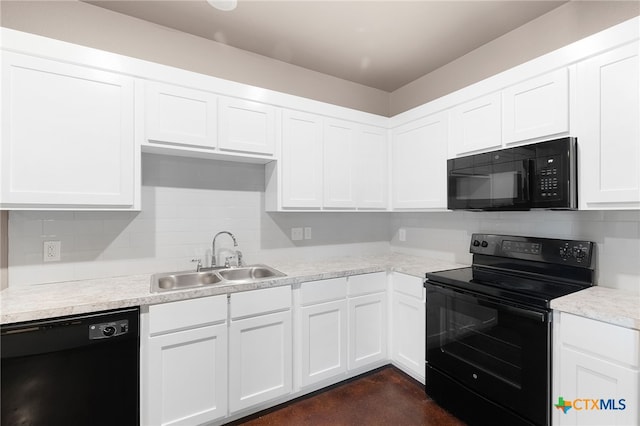 kitchen with white cabinetry, black appliances, and sink