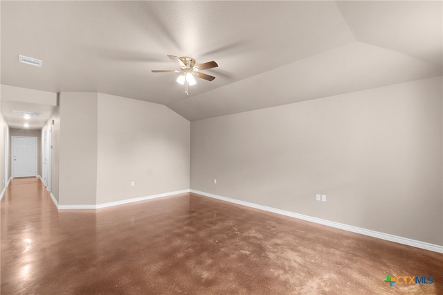 bonus room with lofted ceiling, ceiling fan, and concrete floors