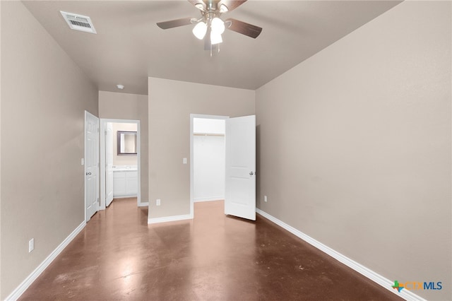 unfurnished bedroom with ceiling fan and ensuite bathroom