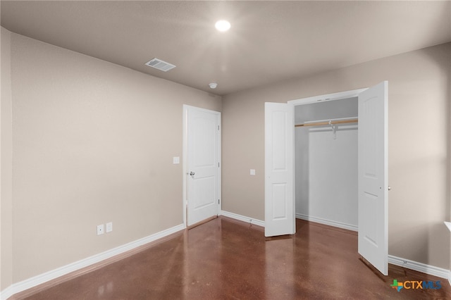 unfurnished bedroom with a closet