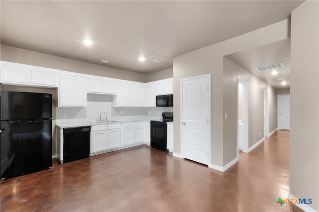 kitchen with black appliances, sink, and white cabinets