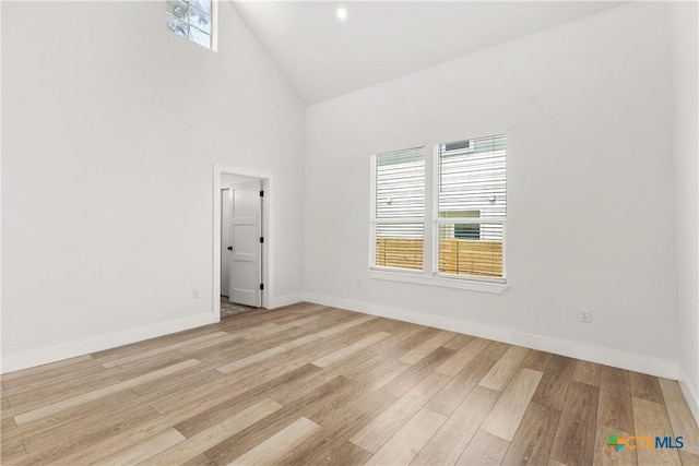 324 Idaho St, San Antonio, TX 78203 - unfurnished room with light wood-style floors, high vaulted ceiling, and baseboards