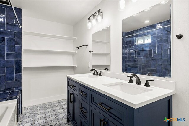 324 Idaho St, San Antonio, TX 78203 - bathroom featuring a tile shower, double vanity, and a bath