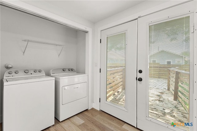 324 Idaho St, San Antonio, TX 78203 - laundry room featuring washer and dryer, light wood-style flooring, and french doors
