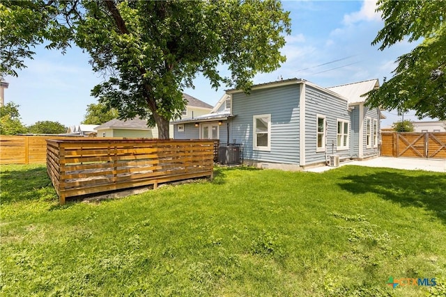 324 Idaho St, San Antonio, TX 78203 - back of house with central AC unit and a deck