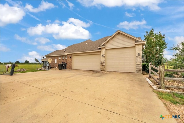 10479 Hartrick Bluff Rd, Temple, TX 76502 - view of front of property featuring an attached garage, concrete driveway, and brick siding