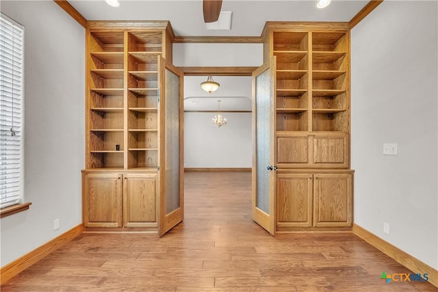 10479 Hartrick Bluff Rd, Temple, TX 76502 - spacious closet with light wood-style flooring and a chandelier