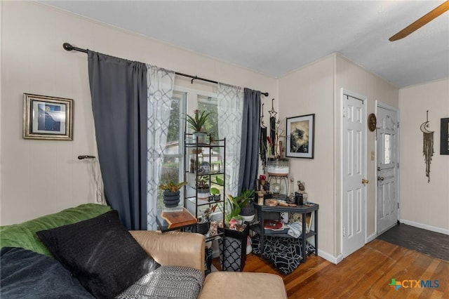 1802 Vine St, Georgetown, TX 78626 - living area with wood finished floors, a ceiling fan, and baseboards