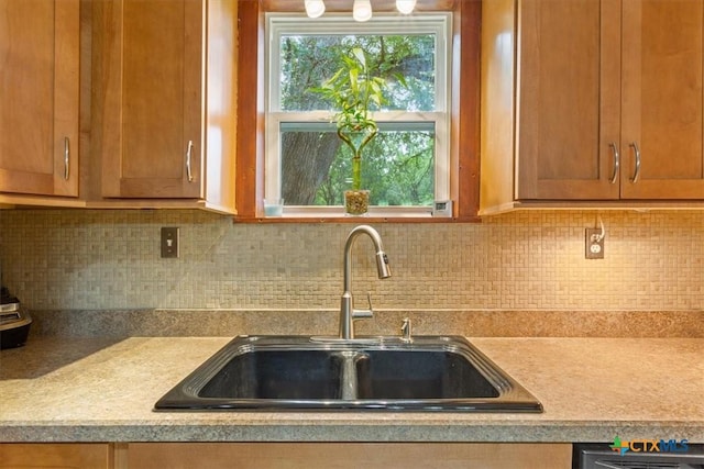 13242 Estate Trl, Belton, TX 76513 - kitchen with light countertops, tasteful backsplash, and brown cabinetry