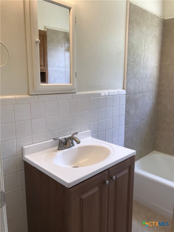 2716 Live Oak Dr, Copperas Cove, TX 76522 - full bathroom with tile walls, vanity, and wainscoting