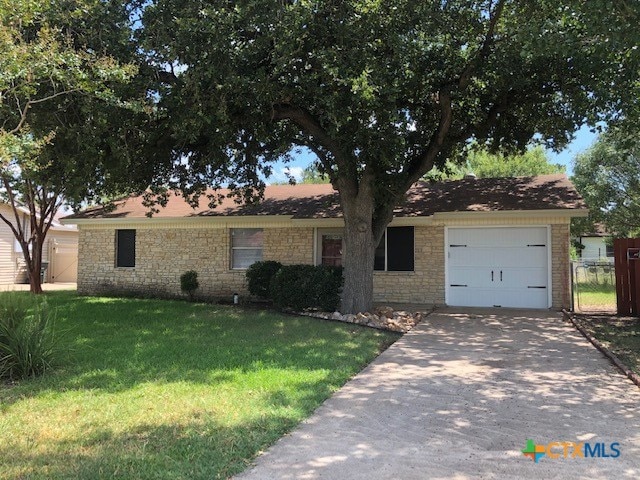 2716 Live Oak Dr, Copperas Cove, TX 76522 - ranch-style home with an attached garage, driveway, and stone siding