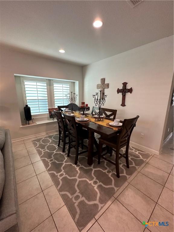 1157 Esplanade Pkwy, San Marcos, TX 78666 - dining room featuring tile patterned floors and recessed lighting