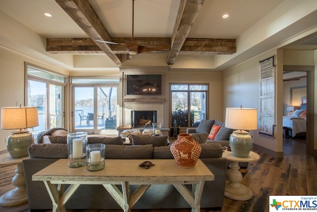 living room featuring dark wood-type flooring and beam ceiling