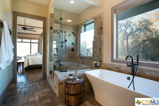 bathroom with hardwood / wood-style floors, ceiling fan, and independent shower and bath