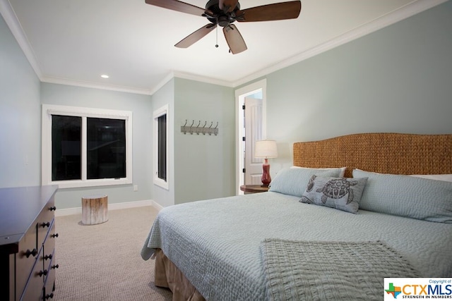 carpeted bedroom with ceiling fan and ornamental molding