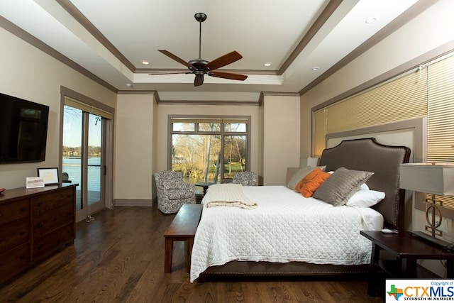 bedroom featuring ornamental molding, ceiling fan, a tray ceiling, dark wood-type flooring, and access to outside