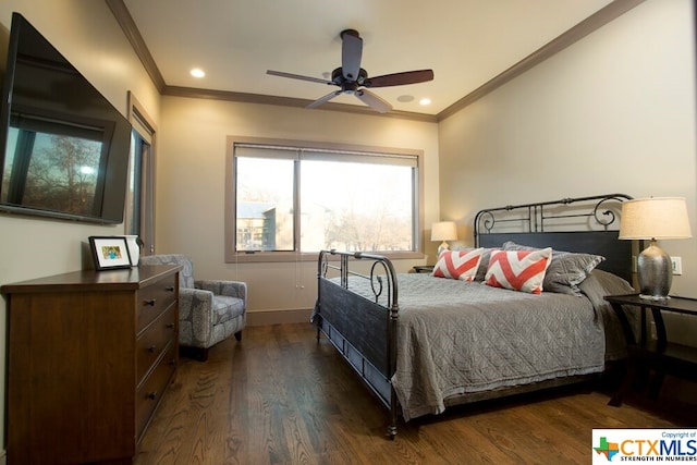 bedroom with dark hardwood / wood-style flooring, ceiling fan, and crown molding