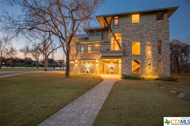 164 Cypress Way, Mcqueeney, TX 78123 - contemporary home featuring stone siding, a balcony, and a front yard
