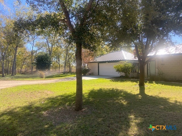 view of yard featuring a garage