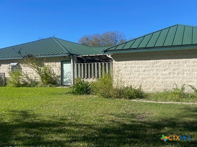 view of home's exterior featuring a lawn