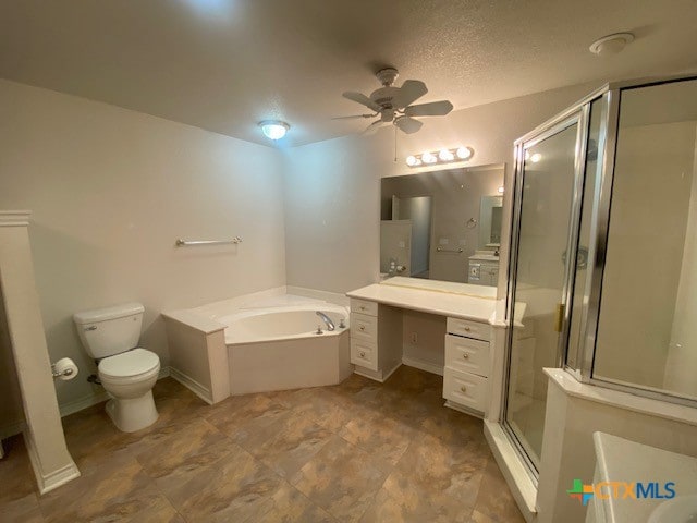 full bathroom with ceiling fan, vanity, separate shower and tub, toilet, and a textured ceiling