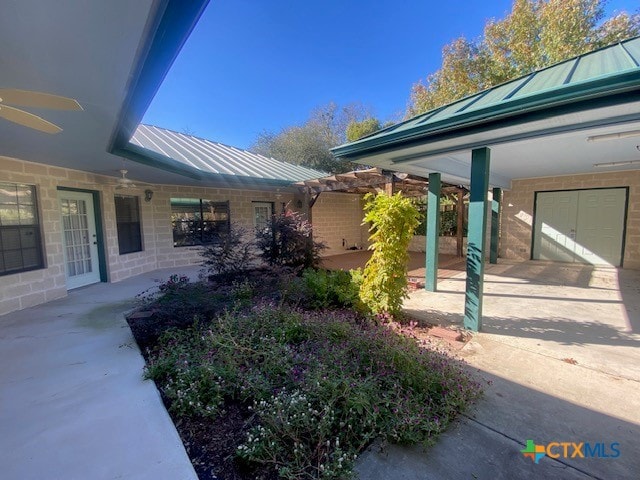 view of side of home featuring ceiling fan