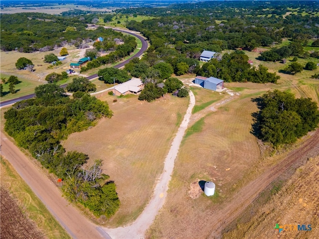 birds eye view of property with a rural view